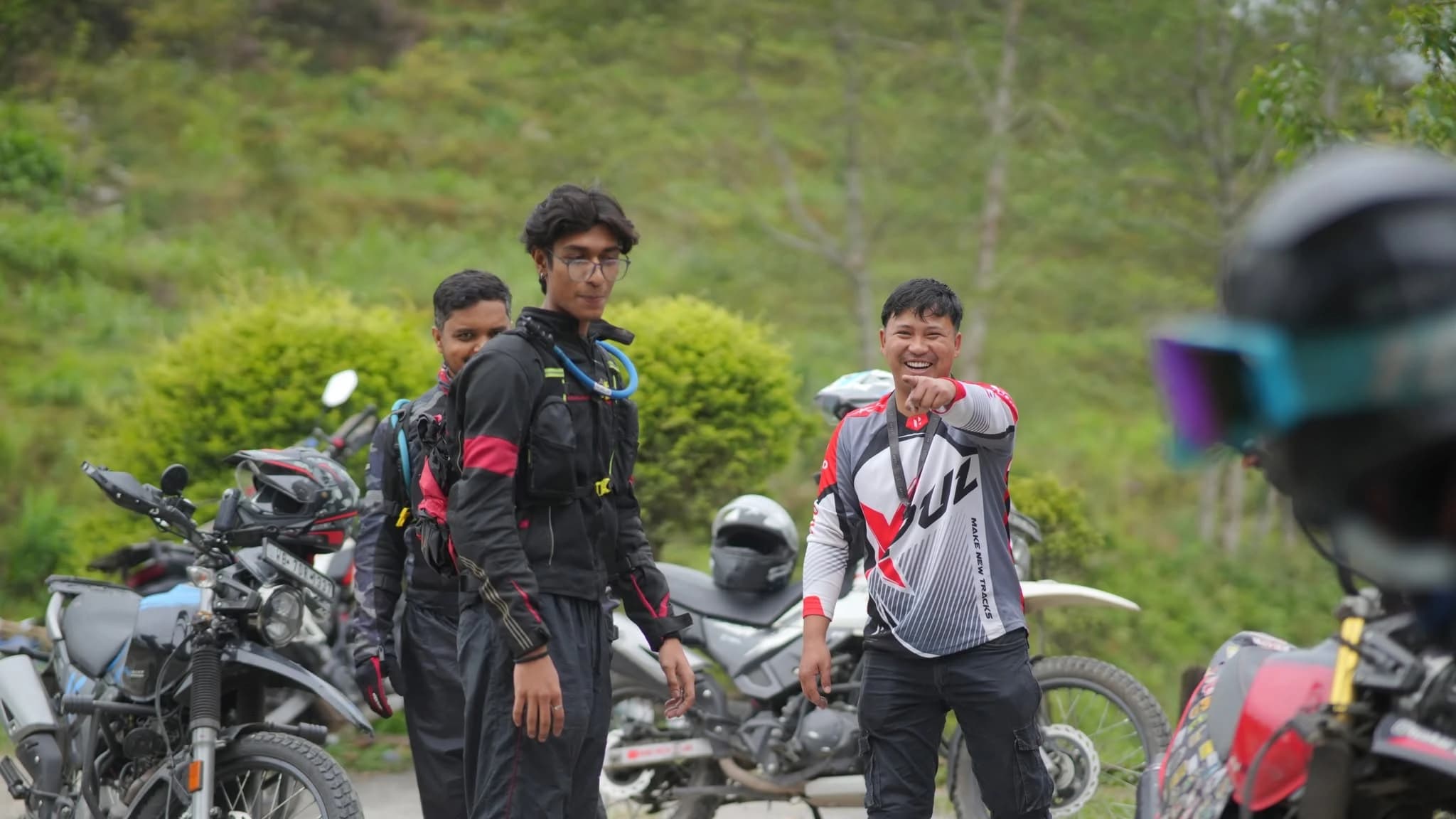 Motology riders sharing a relaxed moment among parked motorcycles